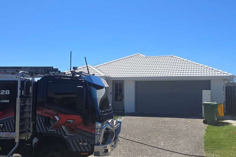 Coated roof on blue house