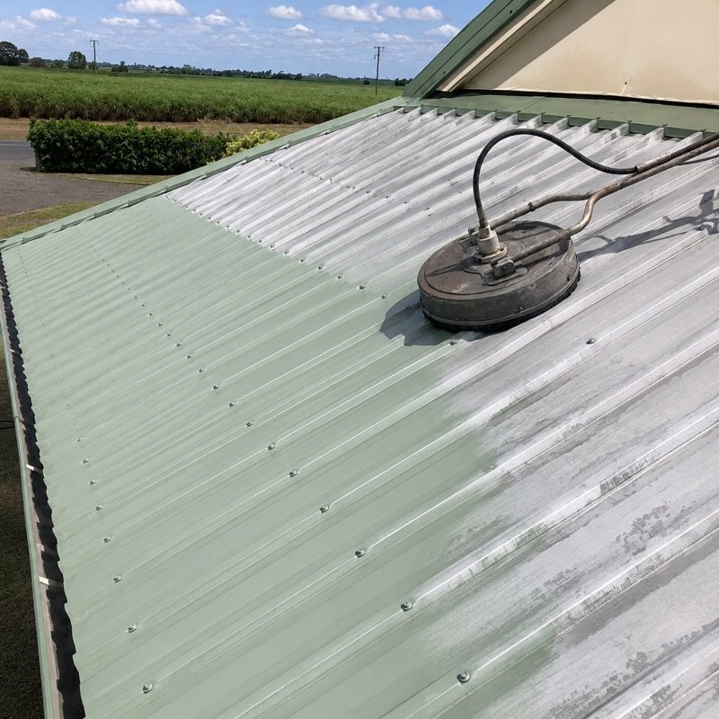 High-pressure cleaning a metal roof